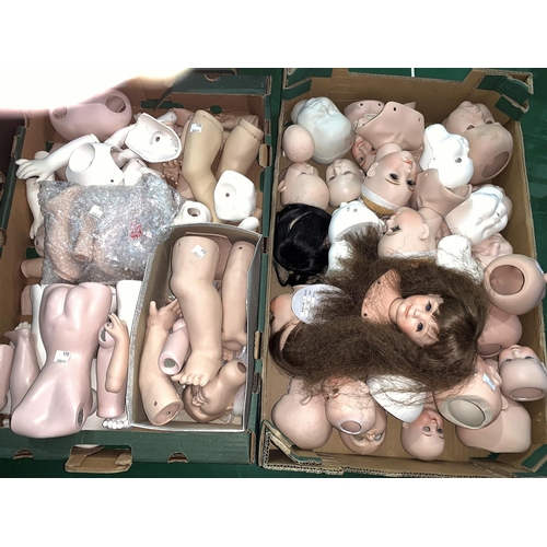 864 - A large selection of unmade doll parts etc