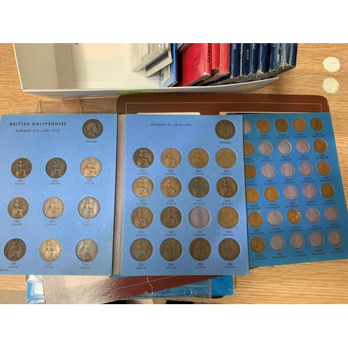 439 - A selection of coin folders and coins