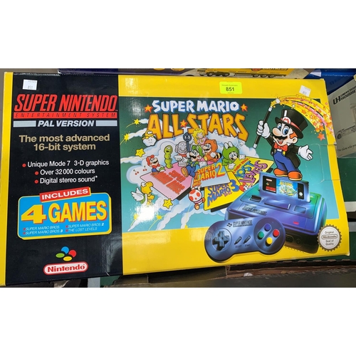 851 - An originally boxed Super Nintendo Entertainment system, Super Mario All-Stars edition with 9 other ... 