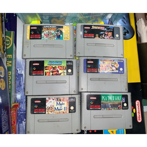 851 - An originally boxed Super Nintendo Entertainment system, Super Mario All-Stars edition with 9 other ... 