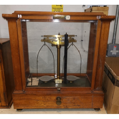 758 - A set of two pan laboratory scales by Oertling, glazed mahogany case, a boxed set of weights