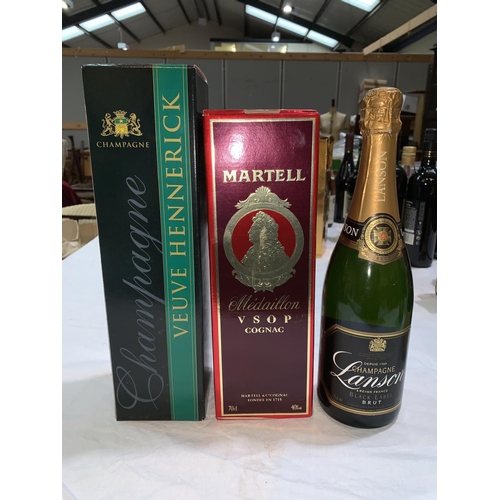 523 - A bottle of Martell Medaillon Cognac boxed; a bottle of Veuve Hennerick Champagne boxed another bott... 