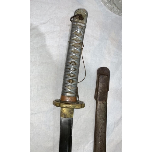 750 - A World War two Japanese katana with metal scabbard and metal alloy handle blade numbered 28147