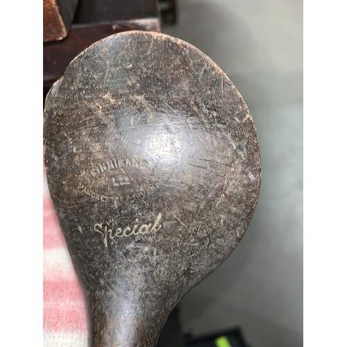 794 - An early 20th century golf bag containing a hard forged mashie St Andrews & 3 other clubs