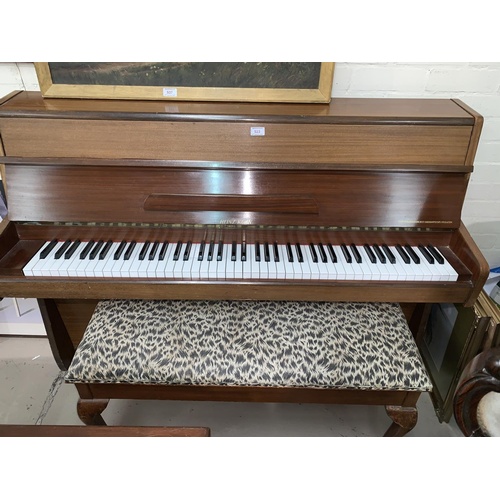 566 - A neat modern sapele teak cased iron framed over strung piano by Heinz Kuhn, with duet stool