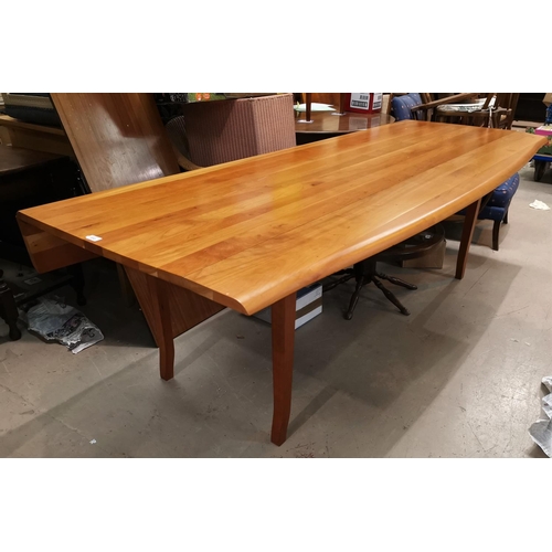 590A - A large modern wakes style table in cherrywood, with shaped drop edges, length 238 cm, extended widt... 