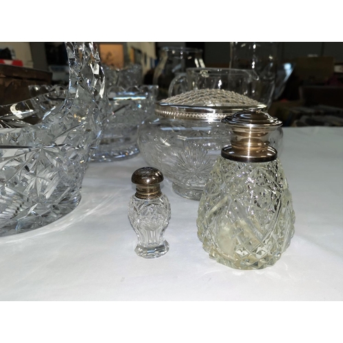 143 - A silver topped cut glass scent bottle, another similar and a selection of cut glass bowls, vases et... 