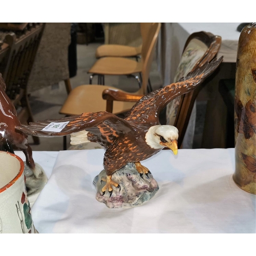 161 - A Beswick pottery figure of a Bald Eagle, width 33 cm