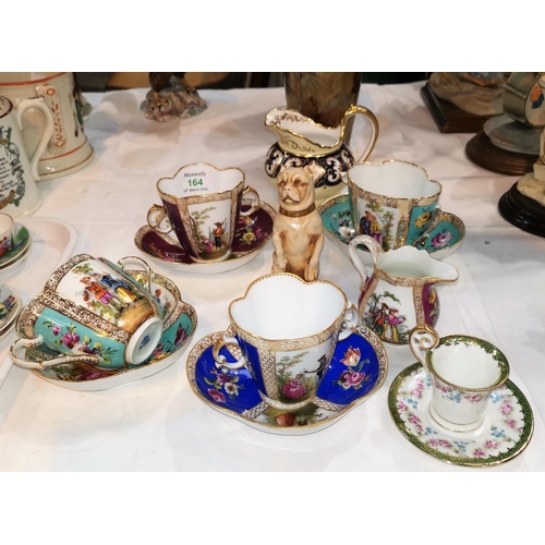 164 - A pair of late Meissen porcelain loving cups with saucers, Augustus Rex; a similar Dresden pair (1 c... 