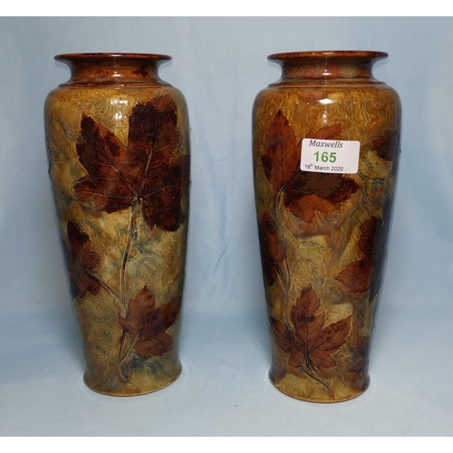 165 - A late 19th century pair of Royal Doulton tapering vases decorated with autumn leaves, impressed mar... 