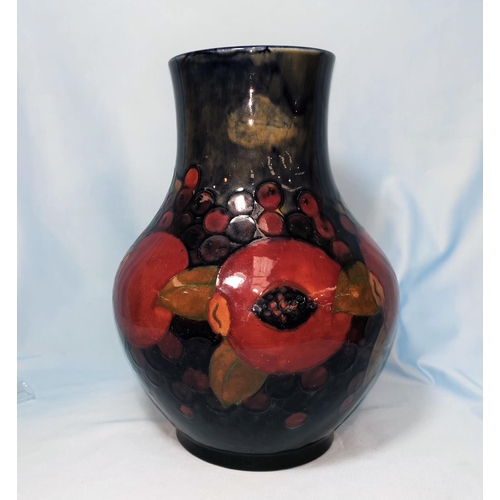 178 - a 1930'S Moorcroft baluster vase decorated in the pomegranate pattern against a blue ground, impress... 