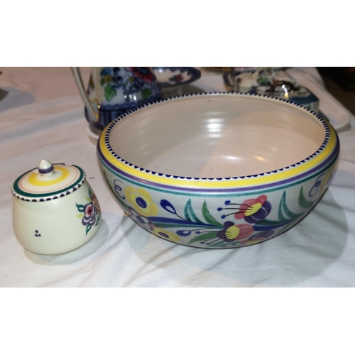 184 - A 1950's Poole fruit bowl, diameter 25cm, and a preserve pot