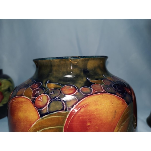 158 - A Moorcroft pottery pomegranite vase of squat form (chip to rim) 15cm