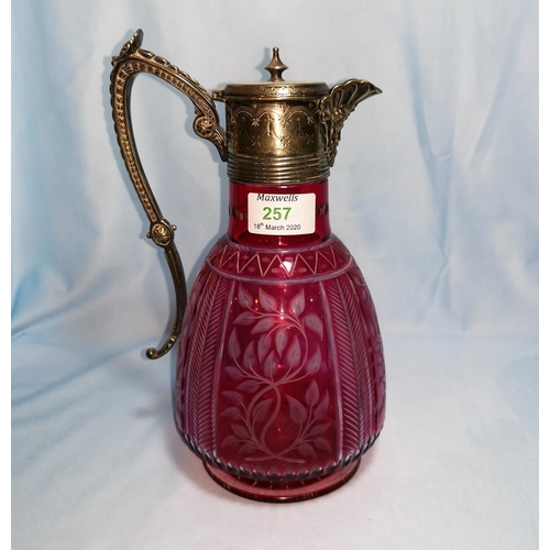 257 - A Victorian claret jug, cut and overlaid cranberry glass with EPNS mount, 26 cm