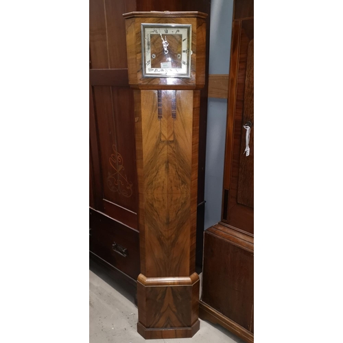 585 - An Art Deco walnut granddaughter clock with chiming movement, by Enfield