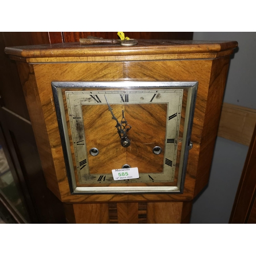 585 - An Art Deco walnut granddaughter clock with chiming movement, by Enfield