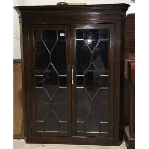 602 - A 19th century mahogany straight front corner cupboard enclosed by 2 glazed doors