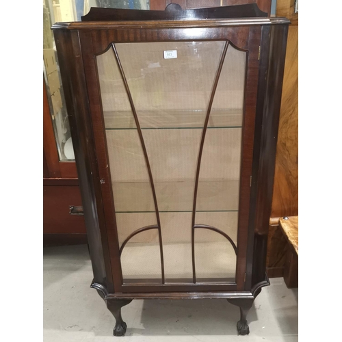 563 - A 1930's small mahogany display cabinet enclosed by single door