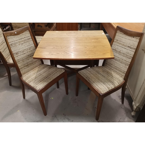 582 - A 1960's golden oak drop leaf dining table with rectangular top; 4 G-Plan dining chairs