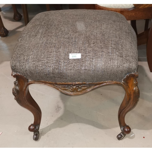 595 - A Victorian walnut stool with square top, on cabriole legs and castors; a similar stool