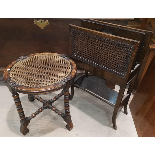 596 - A 1930's oak and cane magazine rack with 2 divisions; a circular occasional table