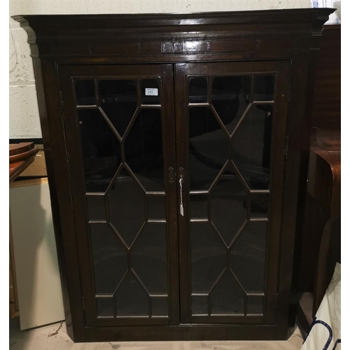 602 - A 19th century mahogany straight front corner cupboard enclosed by 2 glazed doors