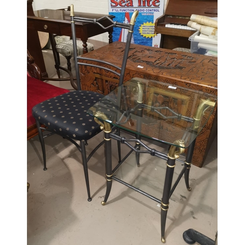 638 - An occasional table and chair in wrought and gilt metal