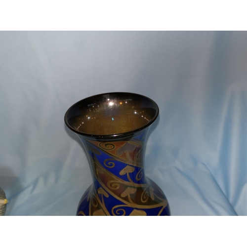 248 - A Royal Lancastrian baluster shaped vase with silvered decoration in spirals on blue ground, signed ... 