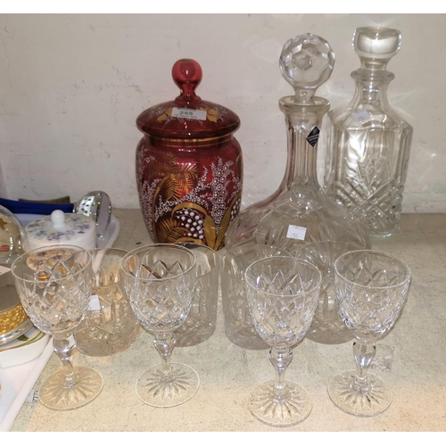 255 - A Mary Gregory style cranberry covered vase; 2 whisky decanters; part suite of cut crystal drinking ... 