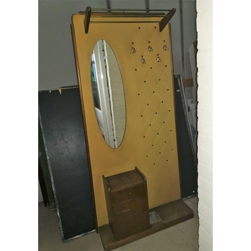 628 - A 1960's hall stand with teak cupboard, oval mirror and hat rack