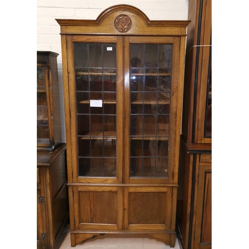 560 - An Edwardian full height bookcase with 2 leaded glass doors and 2 panelled doors