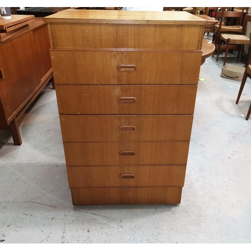 586 - A 1960's gents teak 5 height dressing chest with hinged top dressing mirror