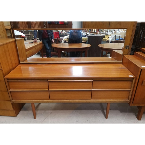 587 - A 1960's teak dressing table with 6 drawers and long mirror