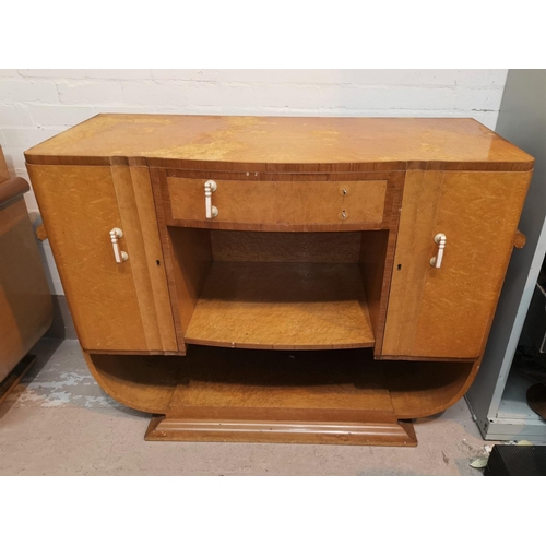 599 - A bird's eye maple Art Deco dining suite with walnut crossbanding, comprising shaped rectangular tab... 