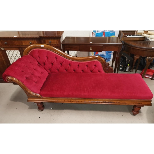 618 - A Victorian mahogany scroll back chaise longue on turned legs and castors, wine dralon