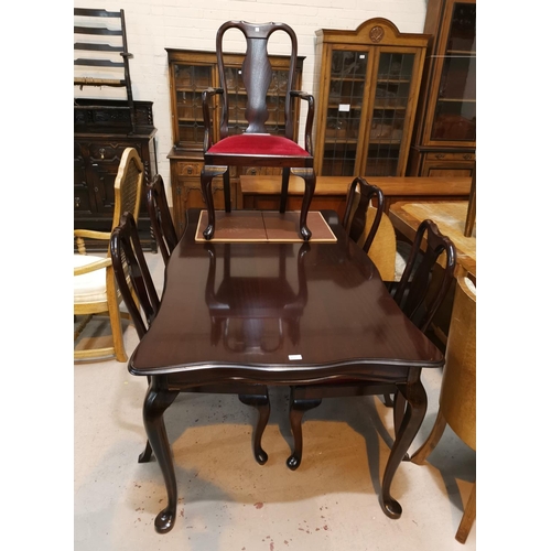 620 - A mahogany reproduction dining suite comprising shaped rectangular table and 6 (4 + 2) chairs on cab... 