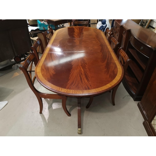 630 - A Regency style inlaid mahogany dining suite by Dickinson's of Ipswich, comprising twin pedestal ext... 