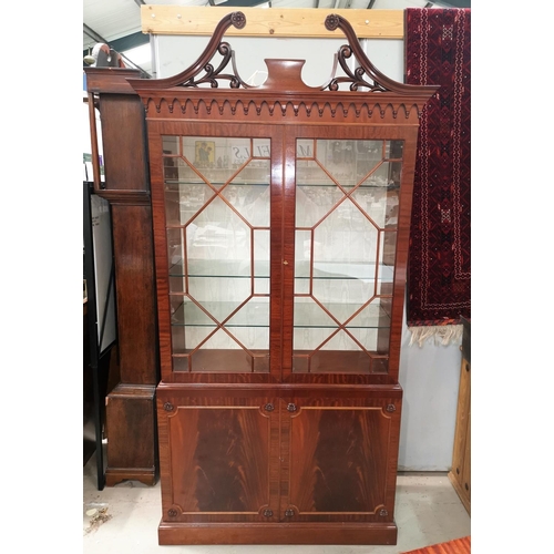 631 - A Regency style inlaid mahogany full height display cabinet by Dickinson's of Ipswich, with 2 astrag... 