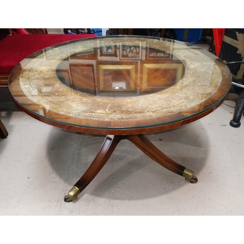 634 - A Regency style inlaid mahogany pedestal coffee table with circular glass top