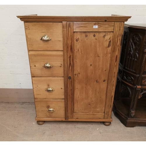 646 - A continental stripped pine side cabinet with single cupboard and 4 drawers