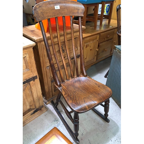 604 - A 19th century country made rocking nursing chair in elm and beech