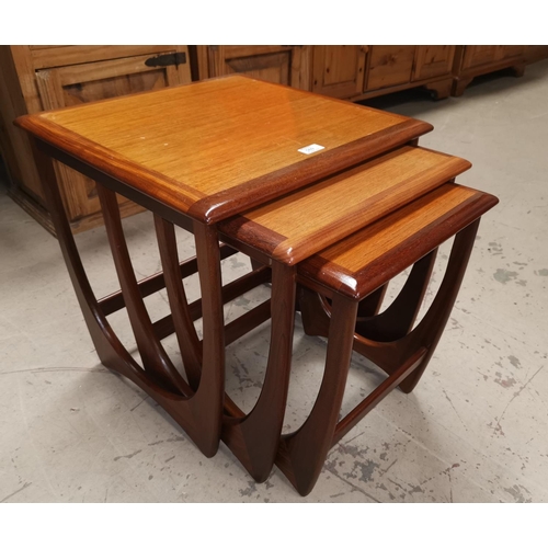 569 - A 1930'S G-Plan nest of 3 teak coffee tables; a walnut nest of 3 occasional tables