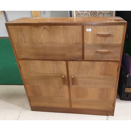 639 - A 1960's side cabinet with fall front; various cupboards