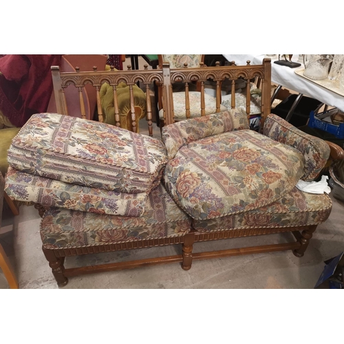 654 - An Ercol country style two seater settee with stick back floral tapestry upholstery