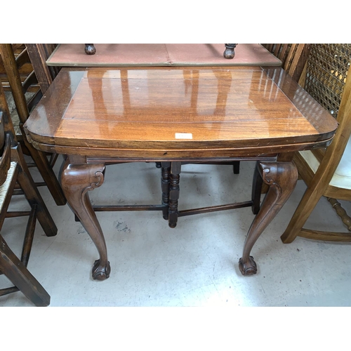 649 - A 1930's mahogany draw leaf dining table on ball and claw feet