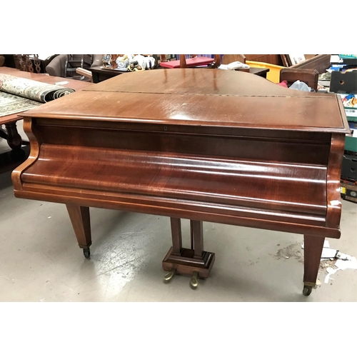 606 - A baby grand piano, overstrung and iron framed, in mahogany case, by Schimmel, with stool