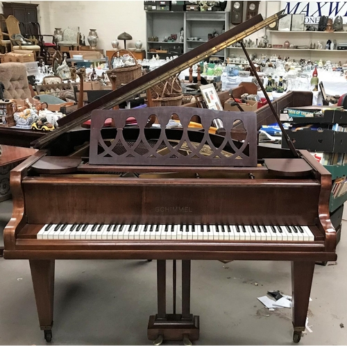 606 - A baby grand piano, overstrung and iron framed, in mahogany case, by Schimmel, with stool