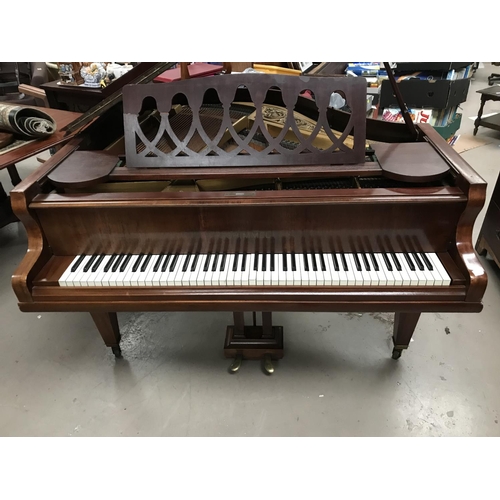 606 - A baby grand piano, overstrung and iron framed, in mahogany case, by Schimmel, with stool