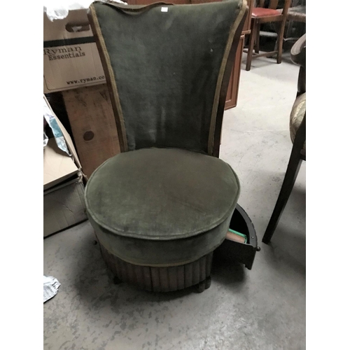 614 - A mid 20th century side chair in green, with base drawers