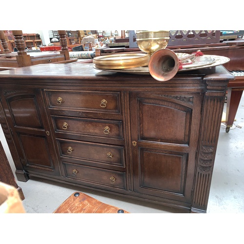 608 - An oak Priory style sideboard